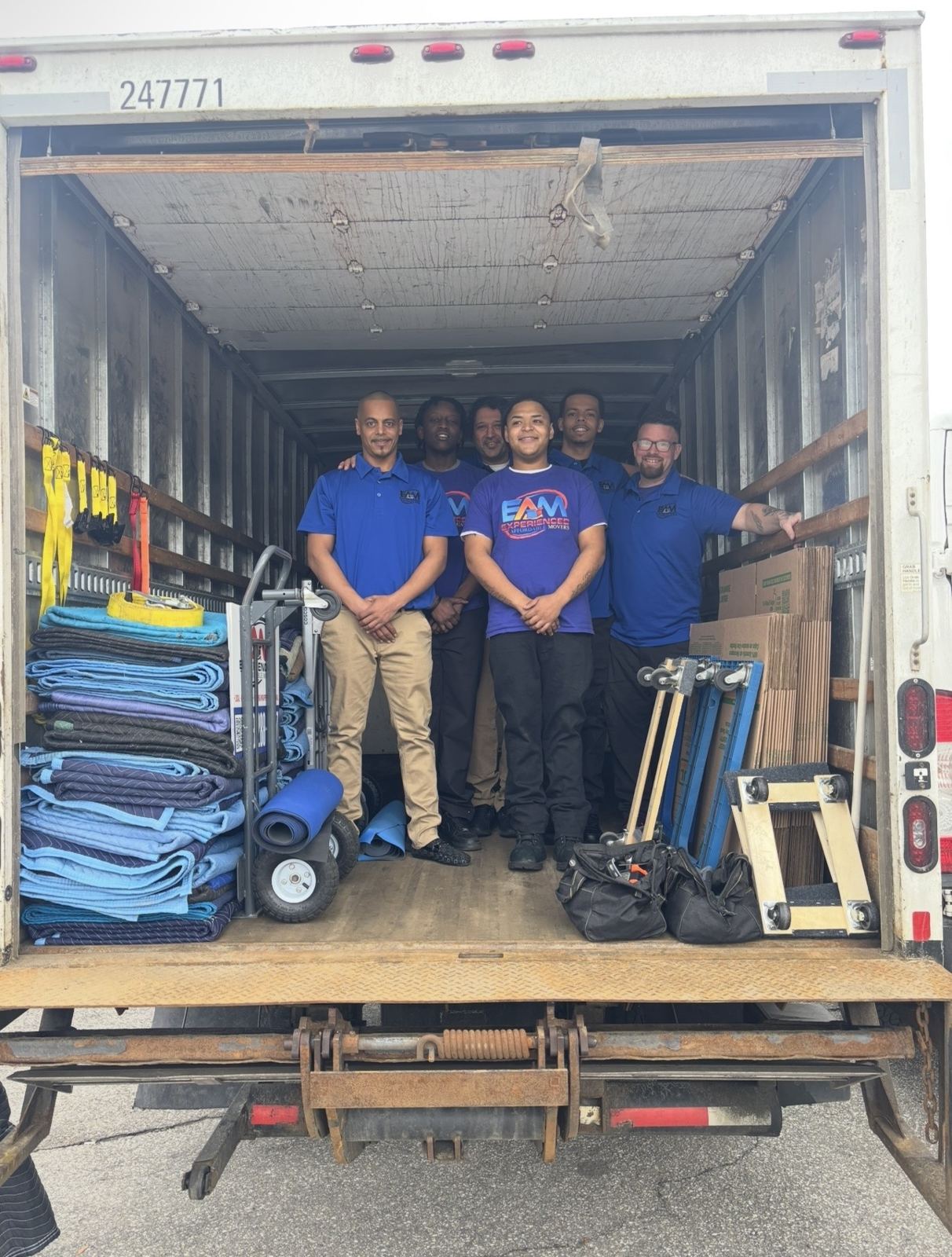 EAM Moving truck and crew at a Manchester, NH home in autumn