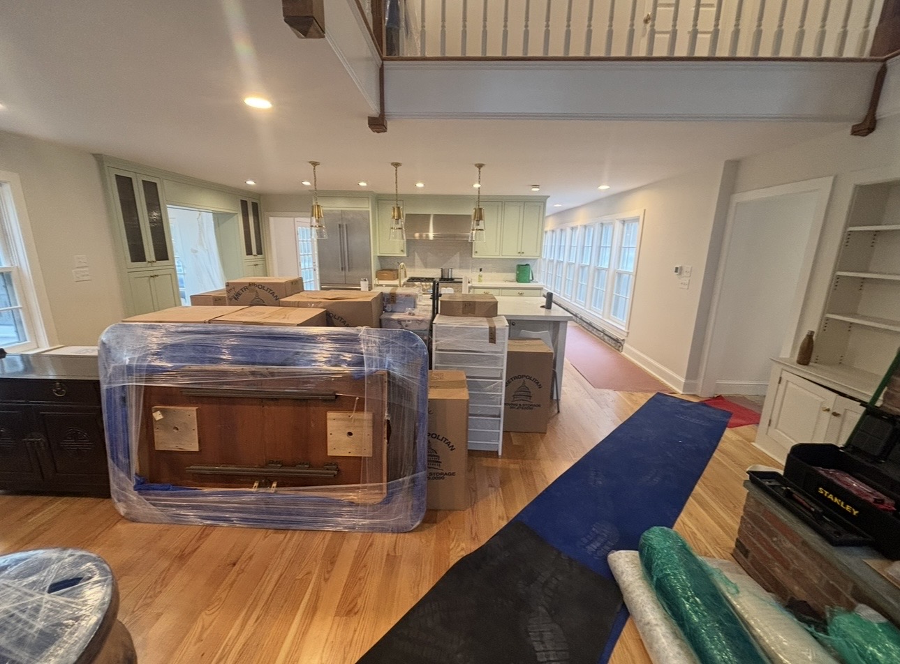 EAM Moving crew full-service move in Exeter, New Hampshire with stretch-wrapped furniture, floor protection, and packed boxes